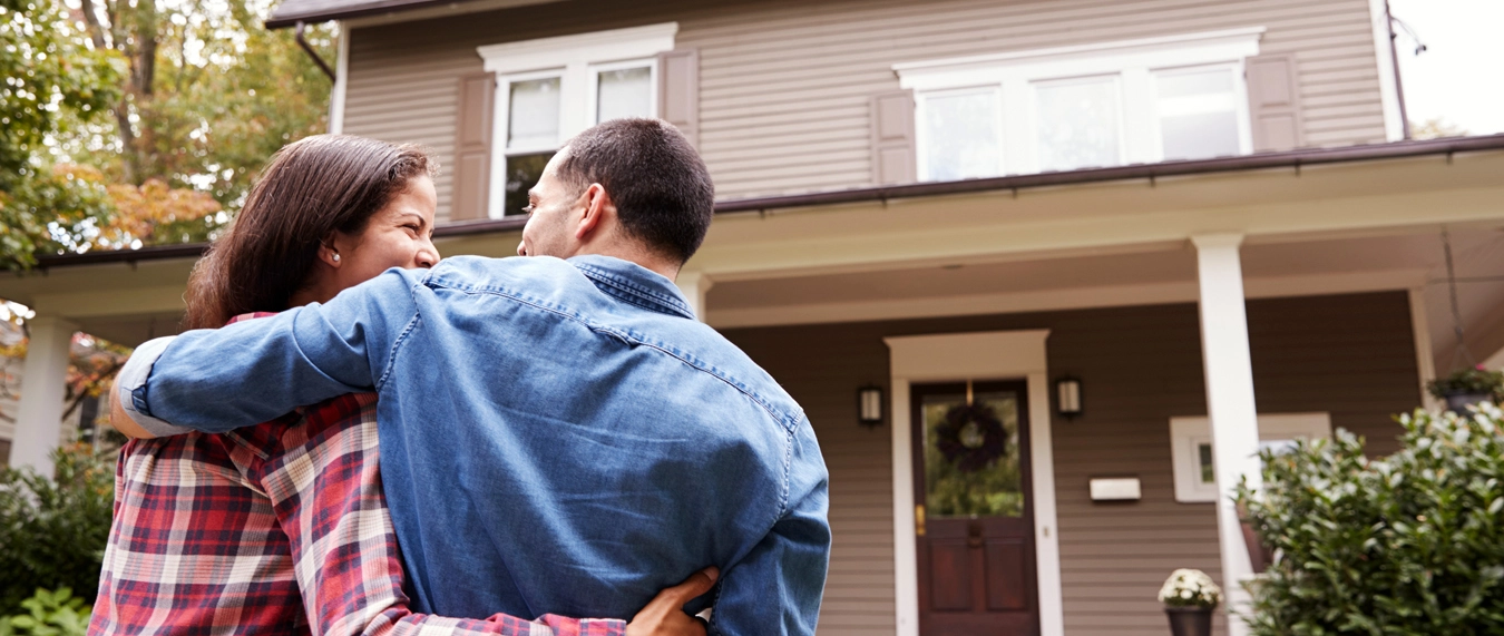 couple in front of home 
