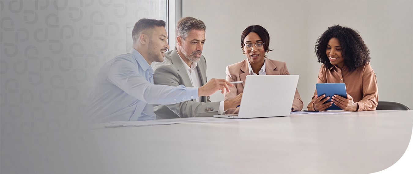 Three professionals collaborating around a laptop in a bright office with documents on the desk and abstract blue design on the side.