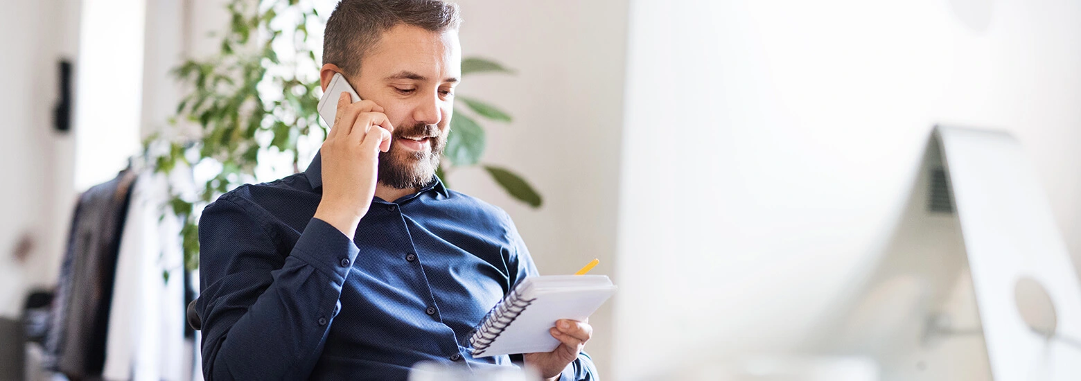 man on phone reporting a lost card