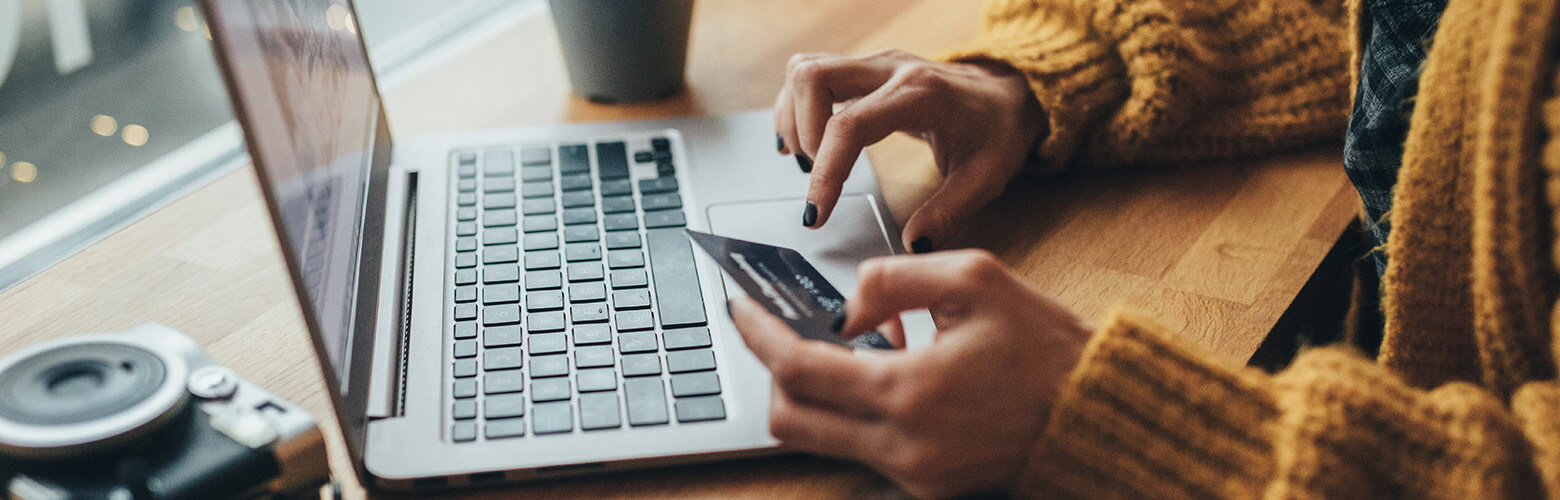 woman online shopping with her credit card