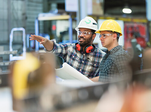 construction workers planning a small business build