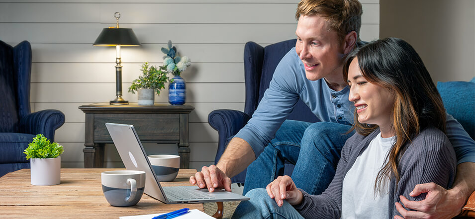 young couple researching mortgage interest rates