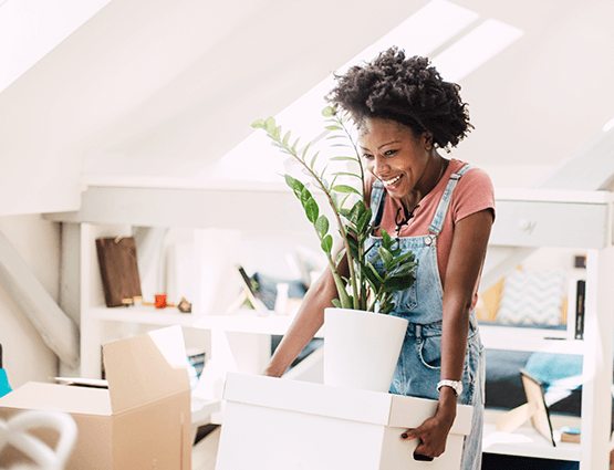 a happy woman who just bought a home