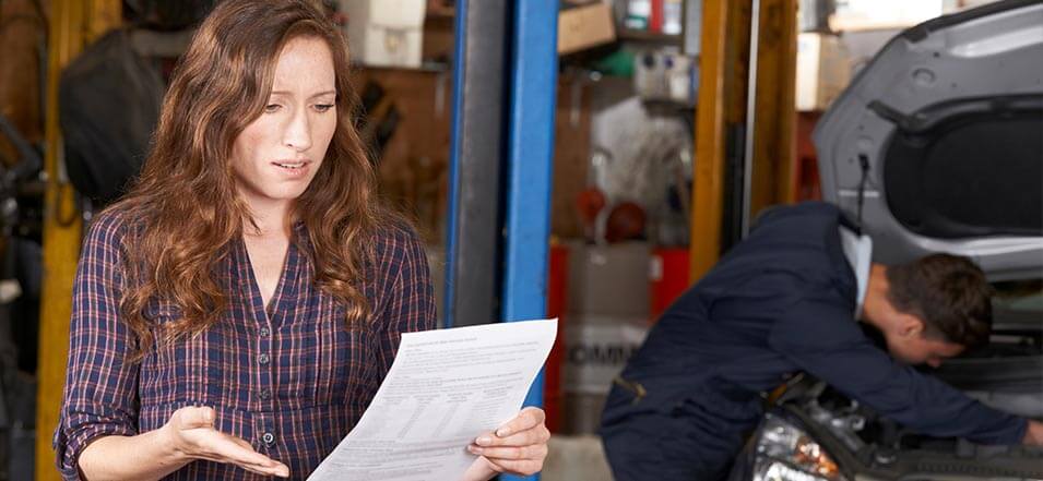 woman worried about an emergency car repair payment