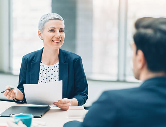 treasury woman helping customer with positive pay