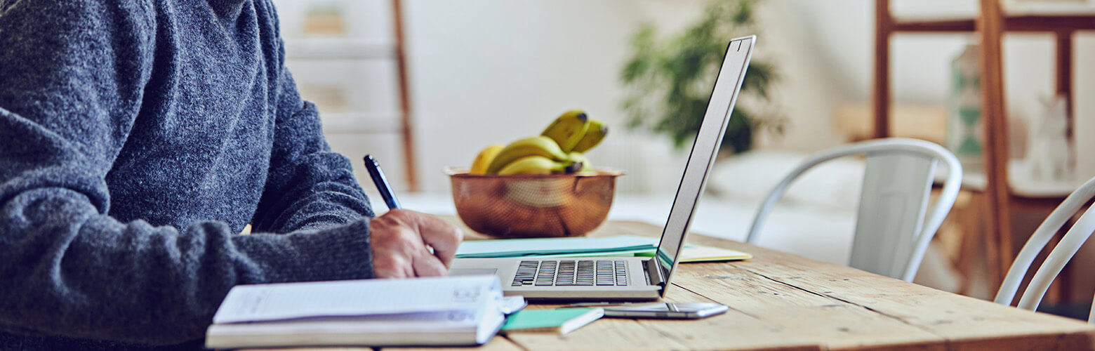 man at desk reviewing Overdraft Protection Services