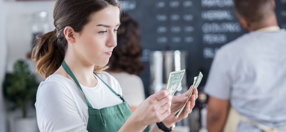 Barista with cash.