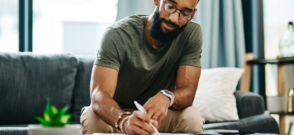 Man at table working on financial plan