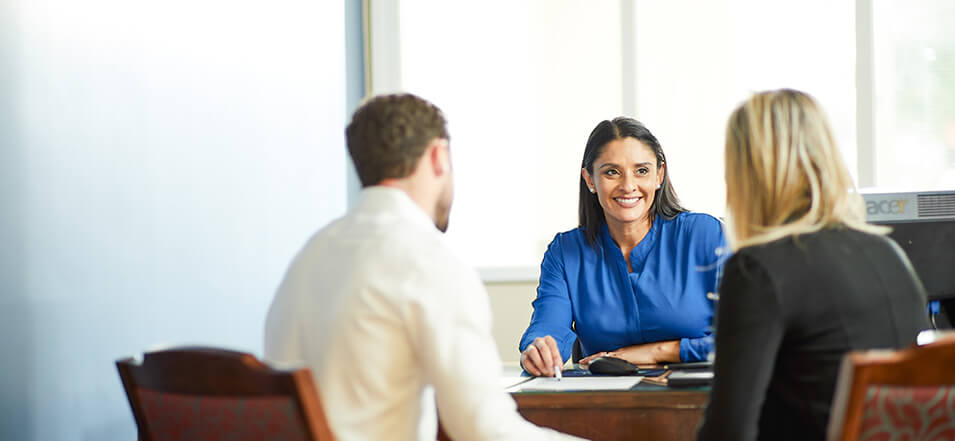 woman banker with clients 