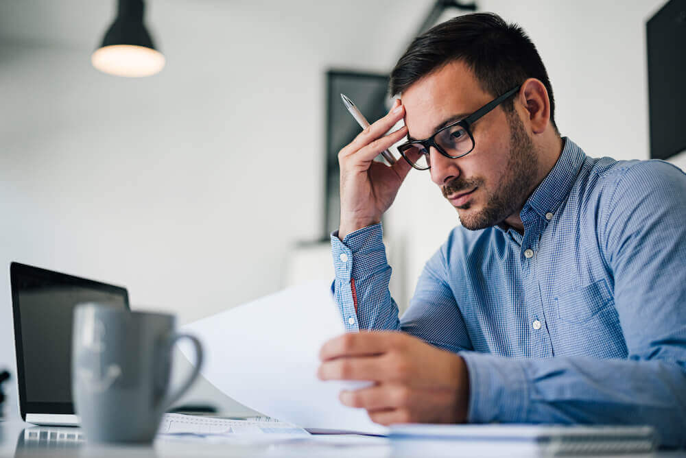 man avoiding a scam with fraud protection