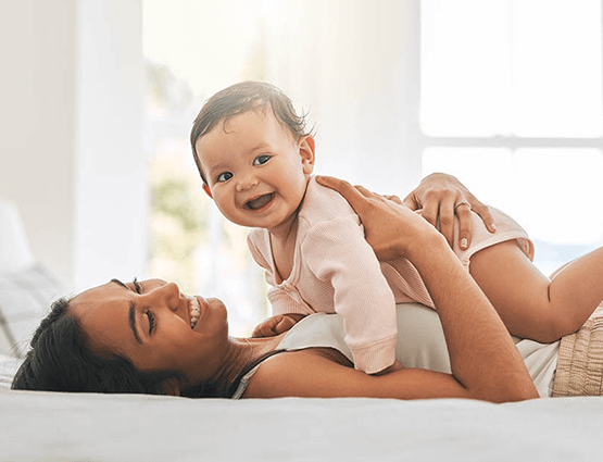 mother and daughter on bed
