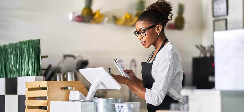 Woman using Clover merchant system