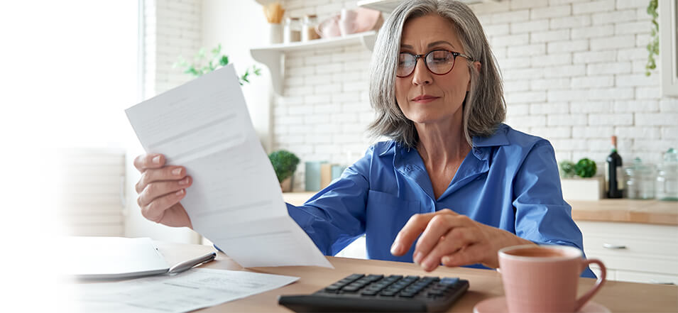 Older woman calculating her savings