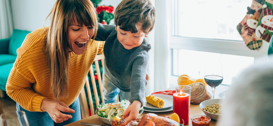 Woman and child setting Christmas table