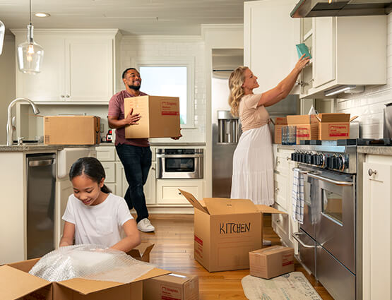 family unpacking into their first home