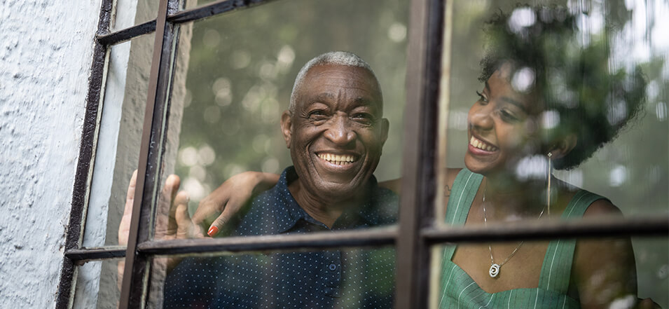 elderly man smiling with daughter