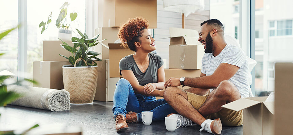 happy couple moving into their first home