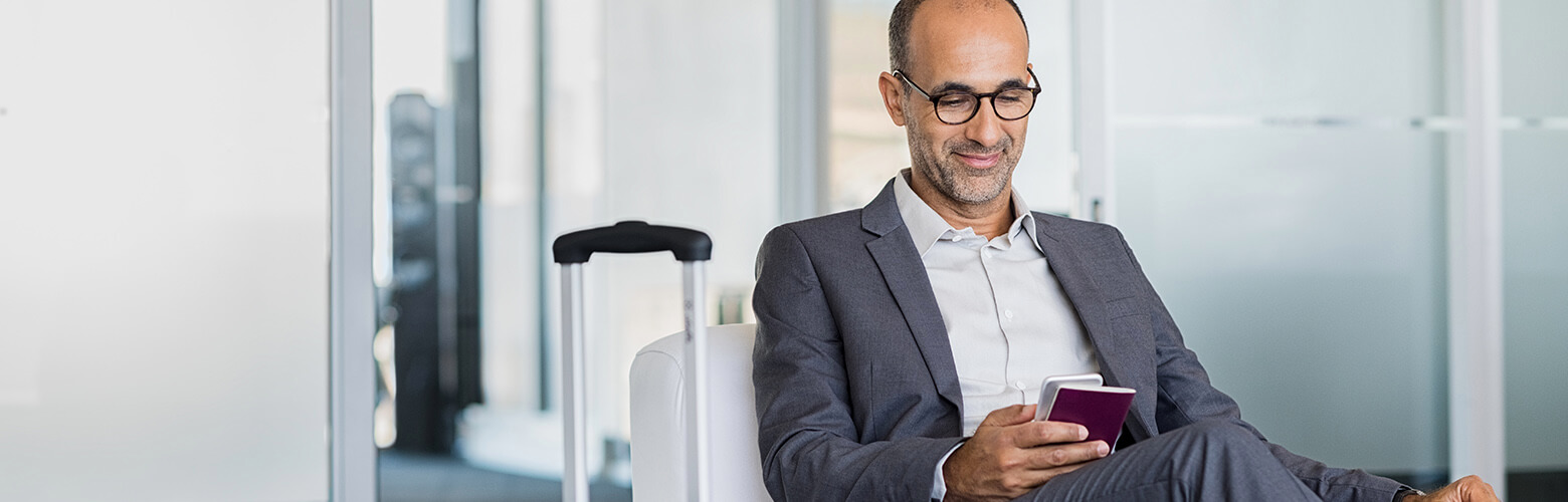 man looking on his mobile device