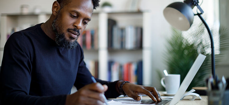 man working on his finances for 2023