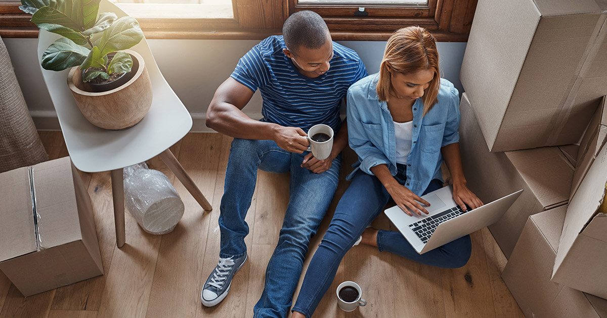 couple checking credit score in home