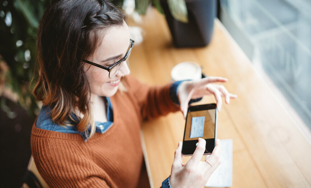 woman depositing check with the United mobile app