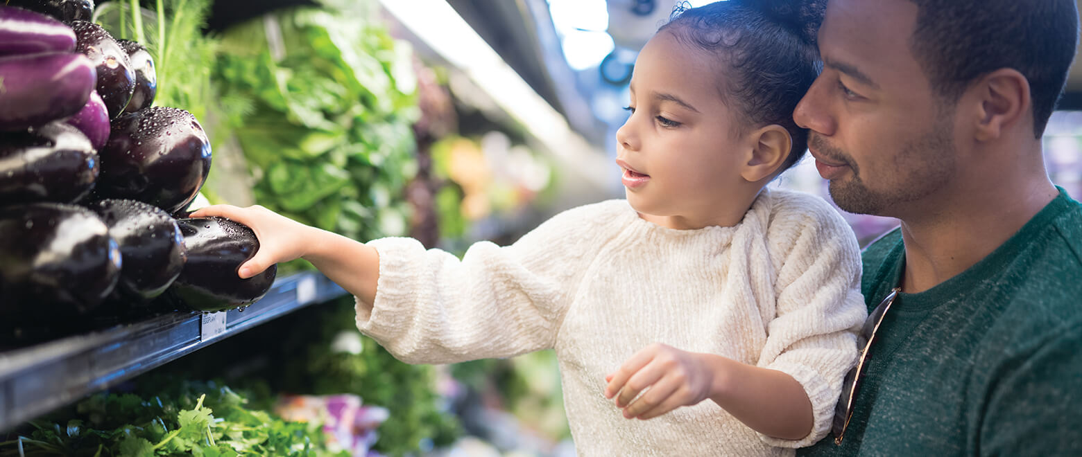 father and daughter grocery shopping