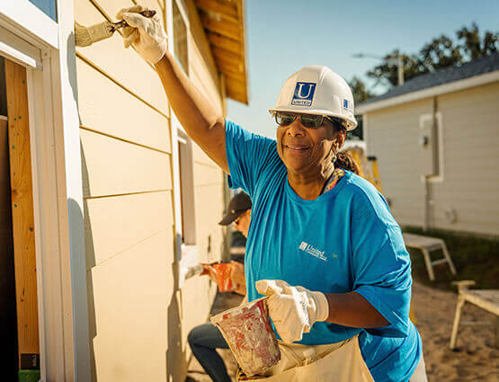 United banker working on a Habitat for Humanity home