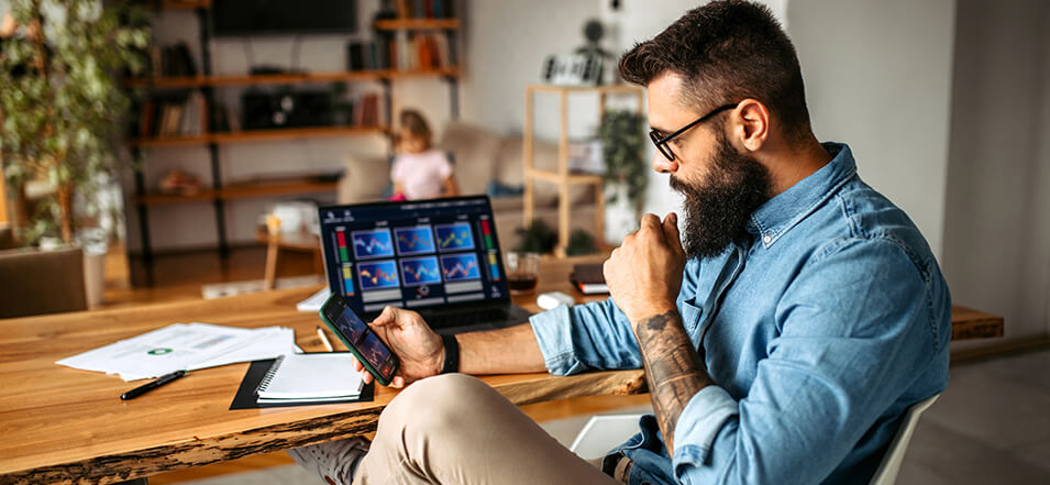 man looking at cryptocurrency on his mobile device