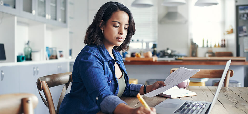 young woman researching on her laptop