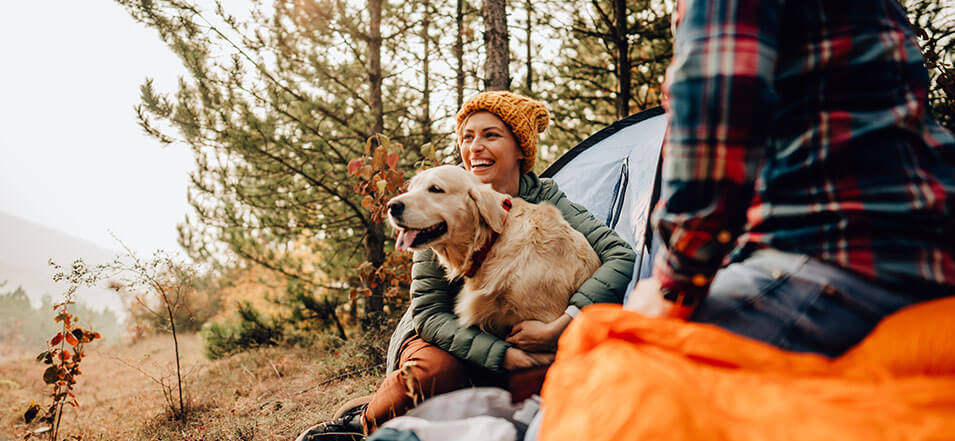 woman with dog in fall