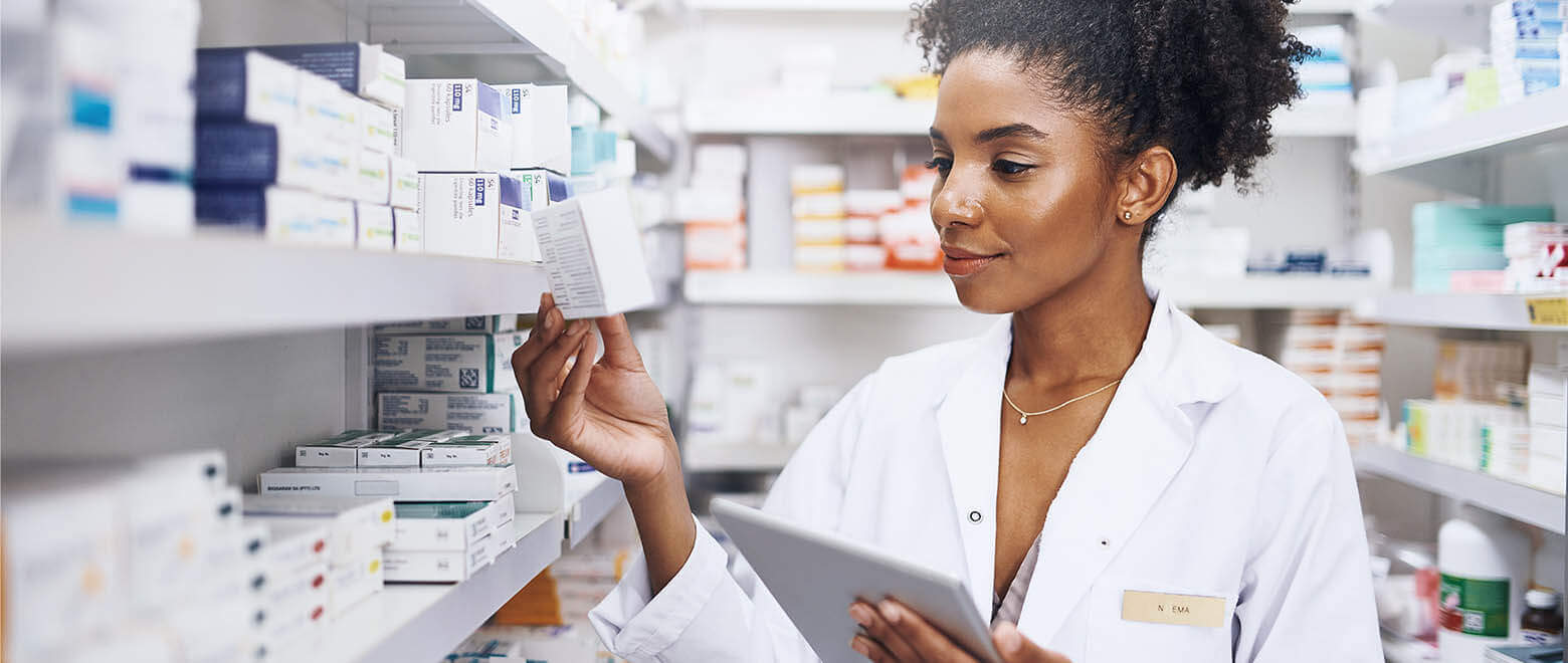 a pharmacist checking on a prescription