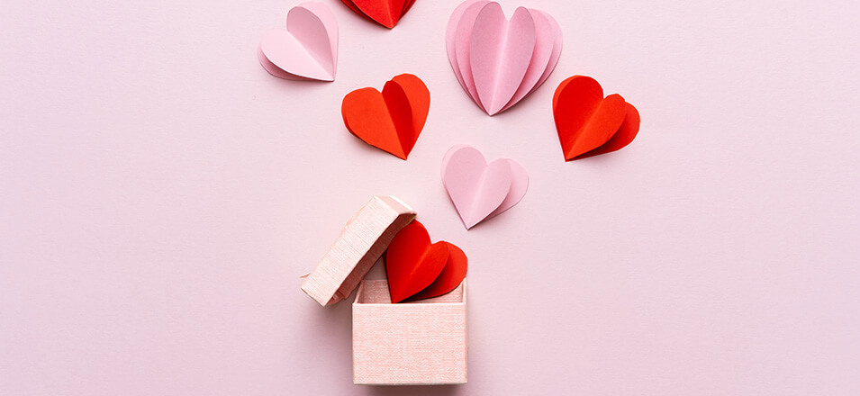 Pink box with cut out hearts coming out of it