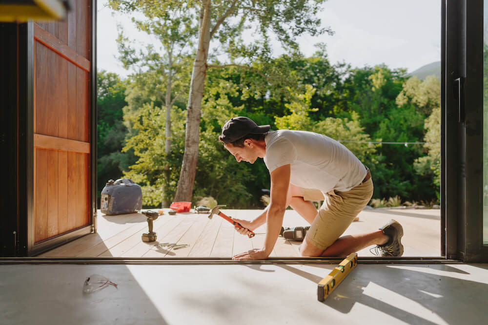 man working on his home with a home equity loan