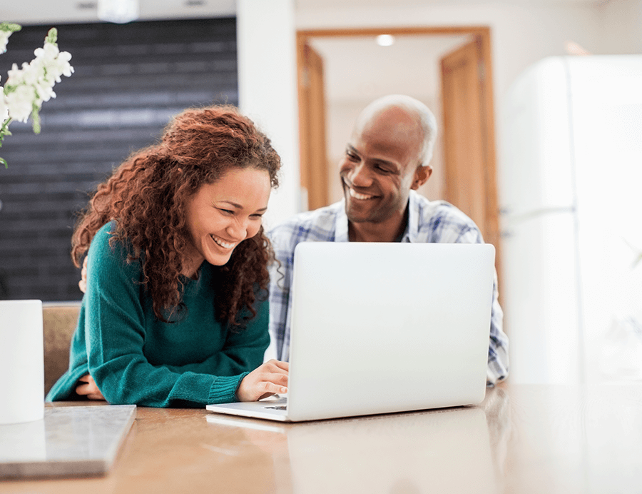 couple looking at their Guided Wealth Portfolio online