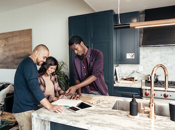 Family reviewing home plans