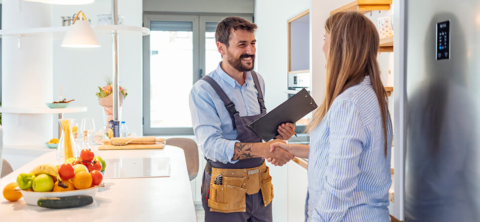 woman meeting with a home inspector at new home