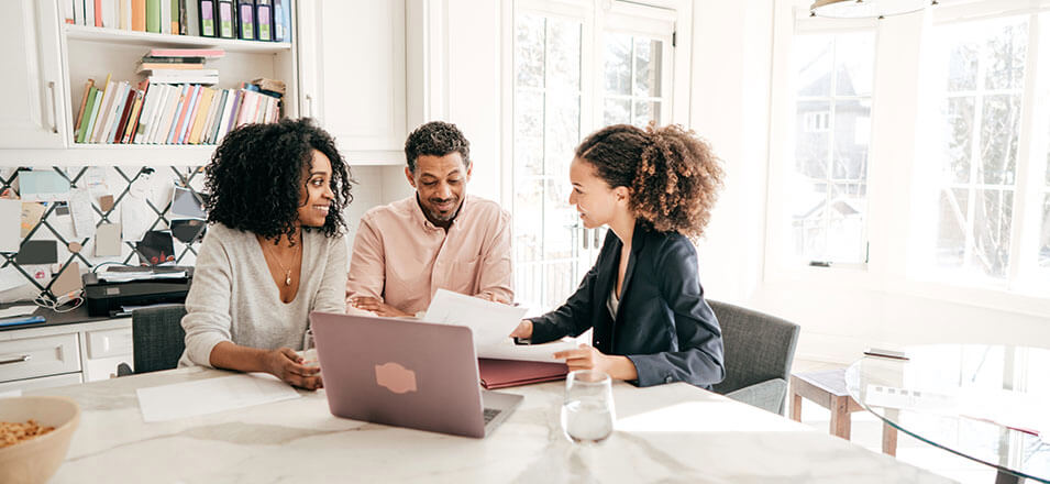 Advisor helping two clients