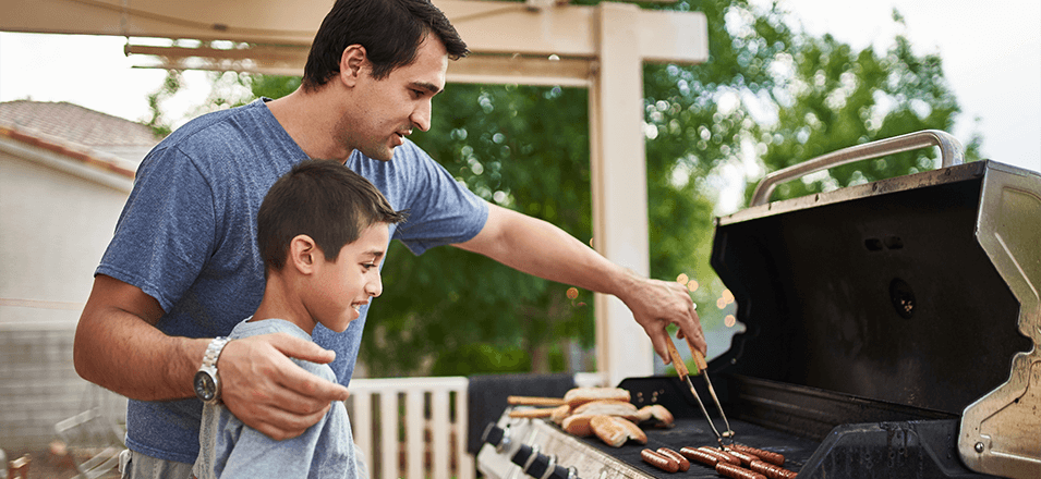 Father and son grilling